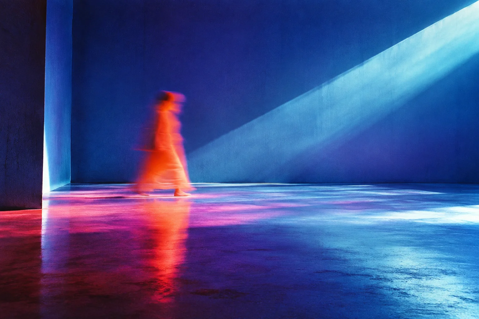An orange figure blurs across a violet room, intersecting a diagonal beam of blue light.