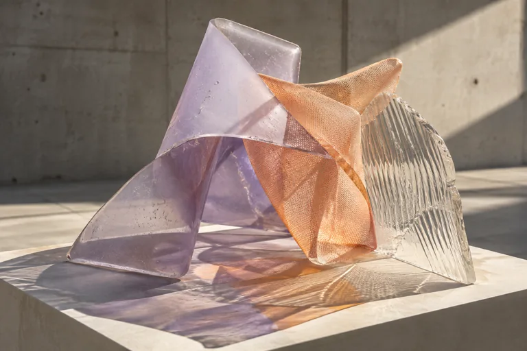 Folded lavender resin, apricot mesh and ribbed glass interlock on a pale plinth, casting layered shadows.